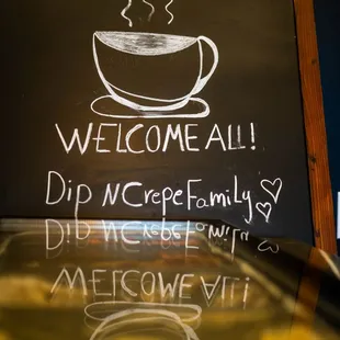 a cup of coffee on a chalkboard