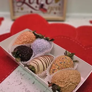 Assorted dipped strawberries Left to right: strawberry shortcake, oreo, cooke butter, fruity pebbles, and churro