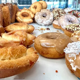 Donuts in their display case.