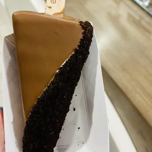 Cookies &amp; cream gelato dipped in milk chocolate with Oreo crumbs