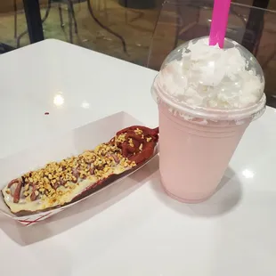 Red Velvet waffle stick dipped in white chocolate and topped with hazelnuts. Strawberry cheesecake shake