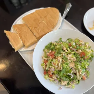 a plate of salad and a sandwich