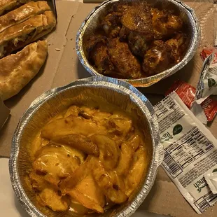 Fries with cheese and chicken wings