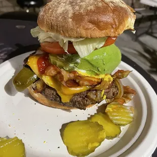 a hamburger with pickles