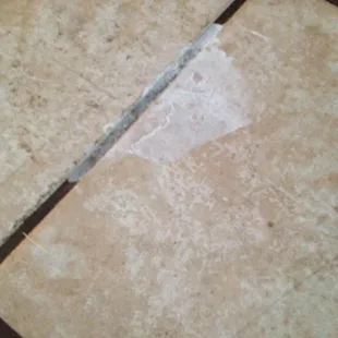 White residue left on my kitchen floor after mixing cleaning solution in my kitchen.