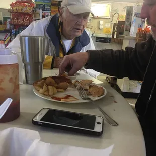 a man eating a plate of food