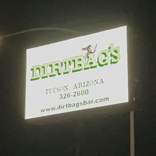 a business sign lit up at night