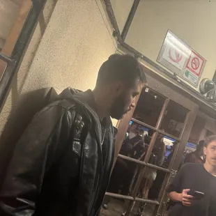 Bouncer thinks he is better than everyone. screams at everyone in line and questions ID's. Works at bags and thinks he is a celebrity