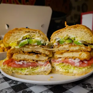 a plate with a cut in half sandwich