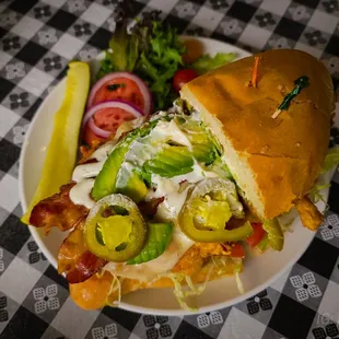 a plate of food on a checkered table cloth