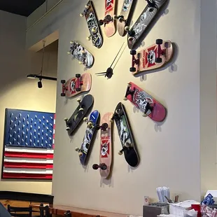 a clock made of skateboards