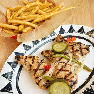 a plate of chicken and french fries