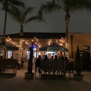 a group of people sitting at a restaurant