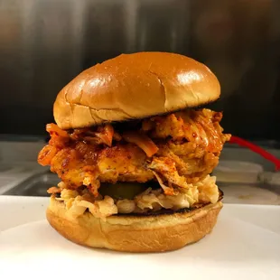 Customize your crispy chicken sandwich with extras like melted cheese, savory bacon, a fried egg, or tangy kimchi!