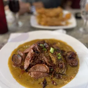 Etouffee with blackened tilapia topped with sausage