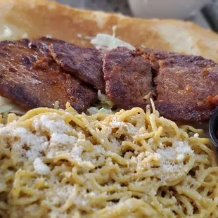 Patton's hot sausage poboy. Had to ask for dry-they put mayo, grilled peppers &amp; onions, tomato and cheese. Upgraded to parm pasta for side.