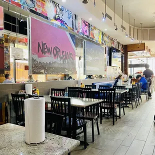 tables, booths, outdoor patio, cool laid back high ceiling modern warehouse space