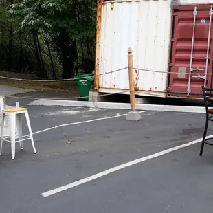 a table and chairs in a parking lot