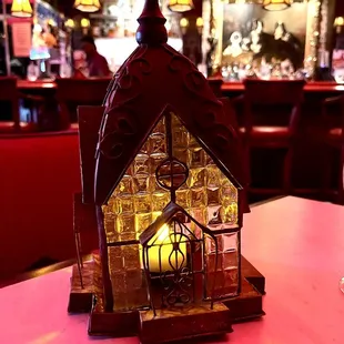 a lighted house on a table