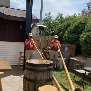 two men in a backyard setting