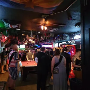 a group of people playing pool