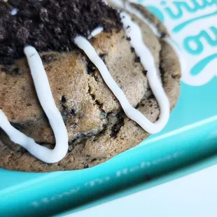 a cookie with white icing on top