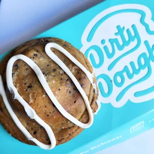 a chocolate chip cookie with white icing
