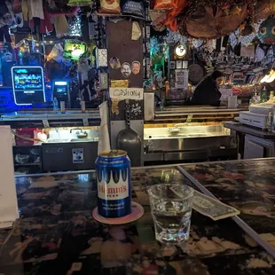 a glass of water on a bar counter