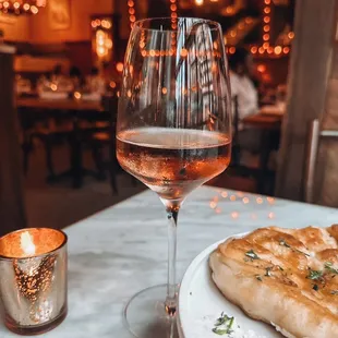 a plate of food and a glass of wine