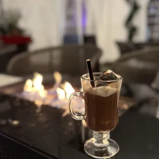 From their winter chalet - Naughty and Nice santa teresa rum | salted dark chocolate | toasted charcoal marshmallow | baileys chocolate