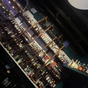 a shelf of liquor bottles