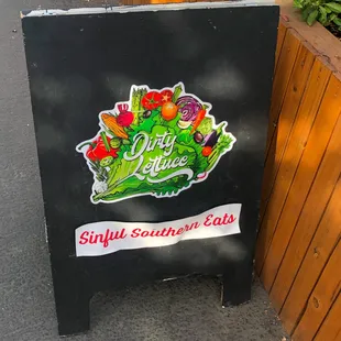 Featured here is a sign for Dirty Lettuce with there slogan, &quot;Sinful Southern Eats.&quot; One of the best vegan restaurants in Portland, Oregon.