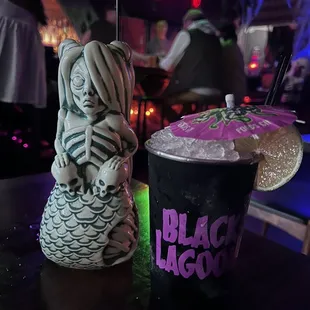  black lagoon drink and a skeleton statue