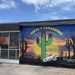 a painting of a bull skull on the side of a building
