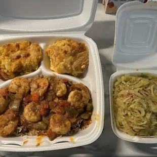 Jerk shrimp dinner with a side of cabbage.