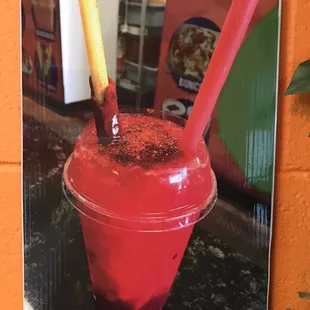 a red drink with a straw