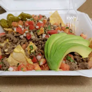 Best nachos in town. Carne asada, beans, cheese, pico de gallo, jalapeños and avacado!!