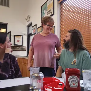 a group of people sitting around a table