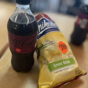 a bag of chips and a bottle of coke