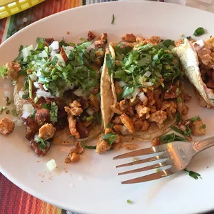 Left to right Al Pastor taco and chicken taco