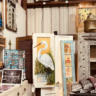 Look at that stunning White Heron painted on a salvaged wood door! Created by New Orleans artist, Paige DeBell.