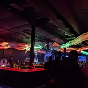 a group of people at a bar