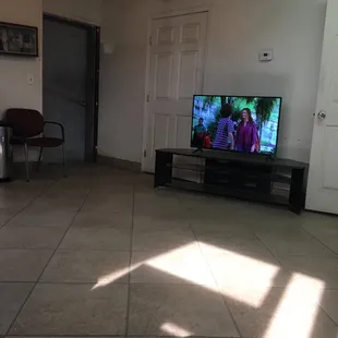 Large tv with plenty of movies to watch.