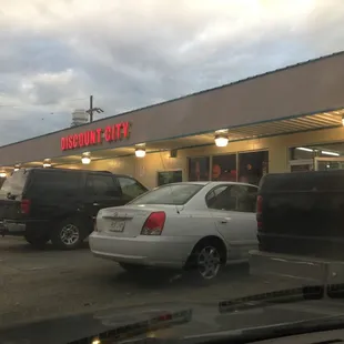 cars parked in front of the store