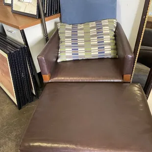 chair and ottoman. Leather $75!!and the pillow too