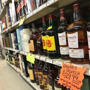 bottles of liquor on shelves in a store