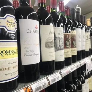 a row of wine bottles in a store