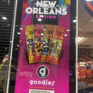 a sign for goodies in a store
