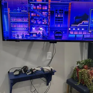 a flat screen television with a city scene on it