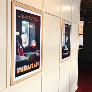 a coffee shop with posters on the wall